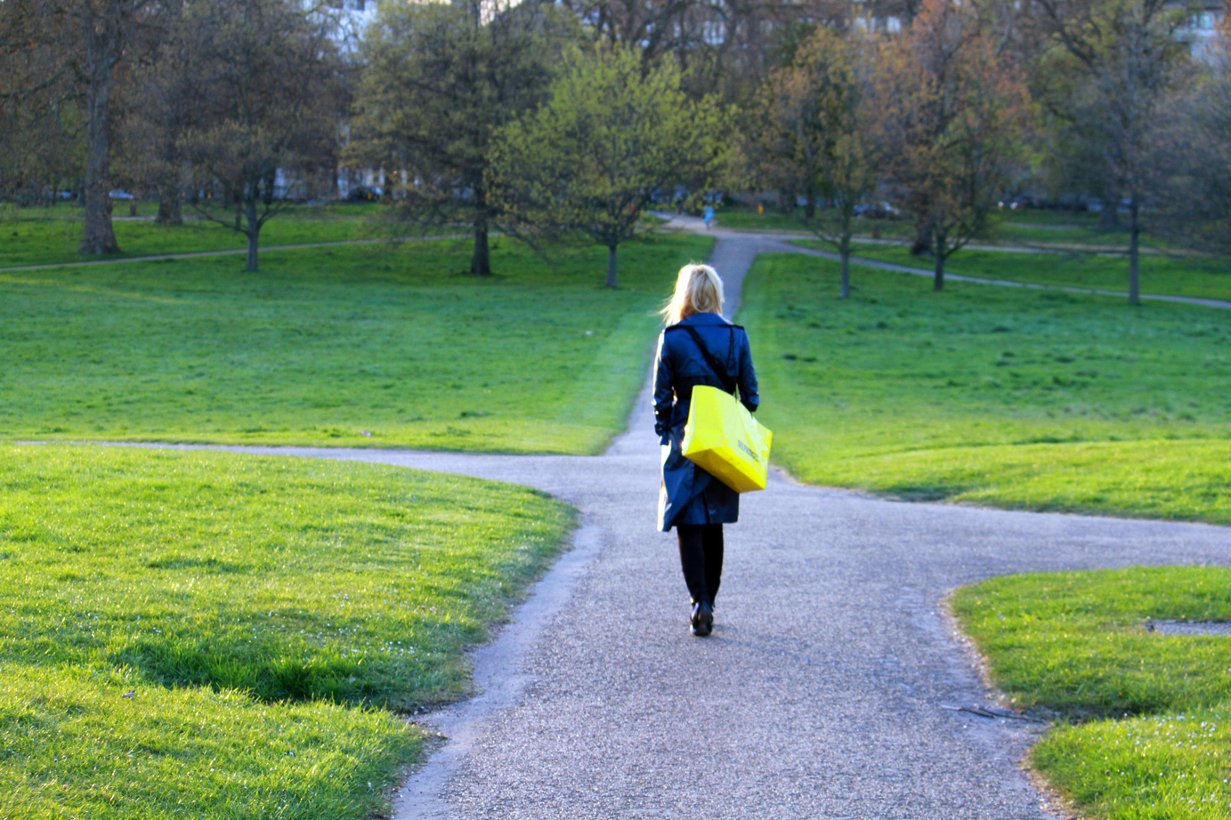 Woman Walking Alone a Narrow Path