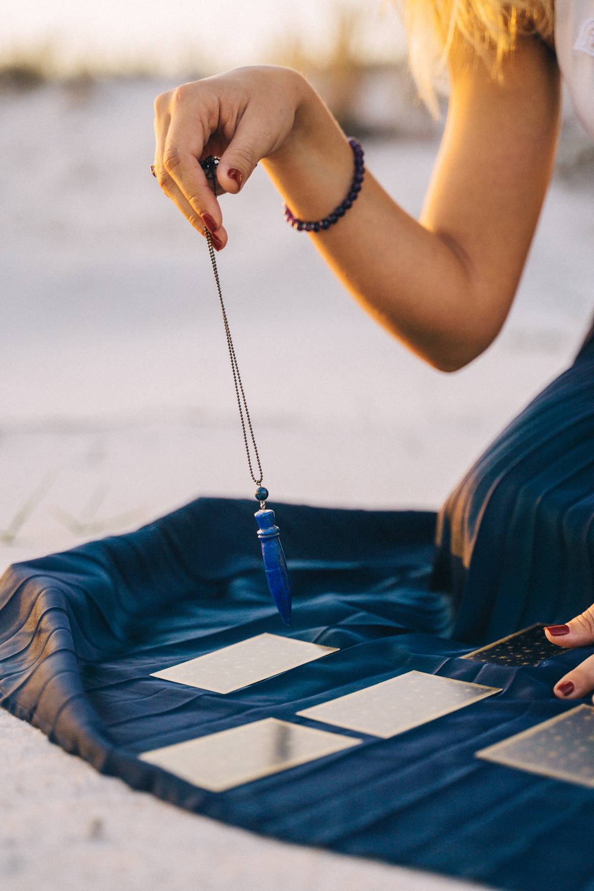 A Woman With a Crystal and Tarot Cards